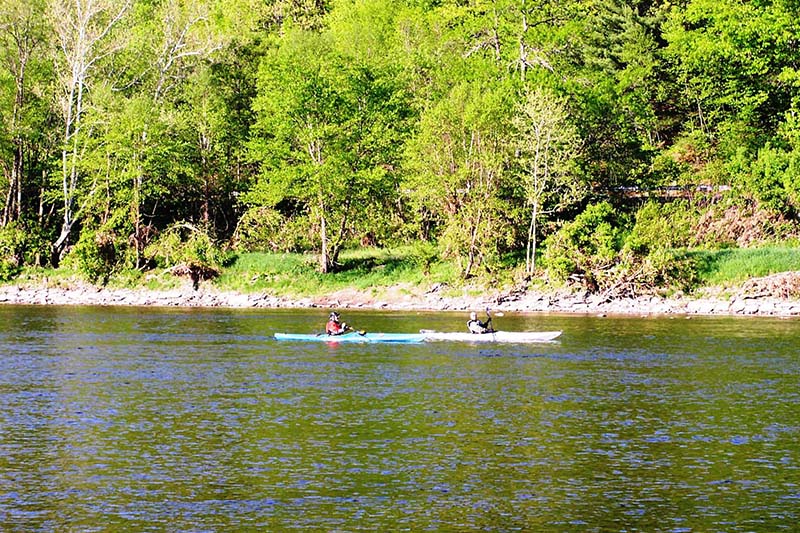 Kayaks paddling by the inn